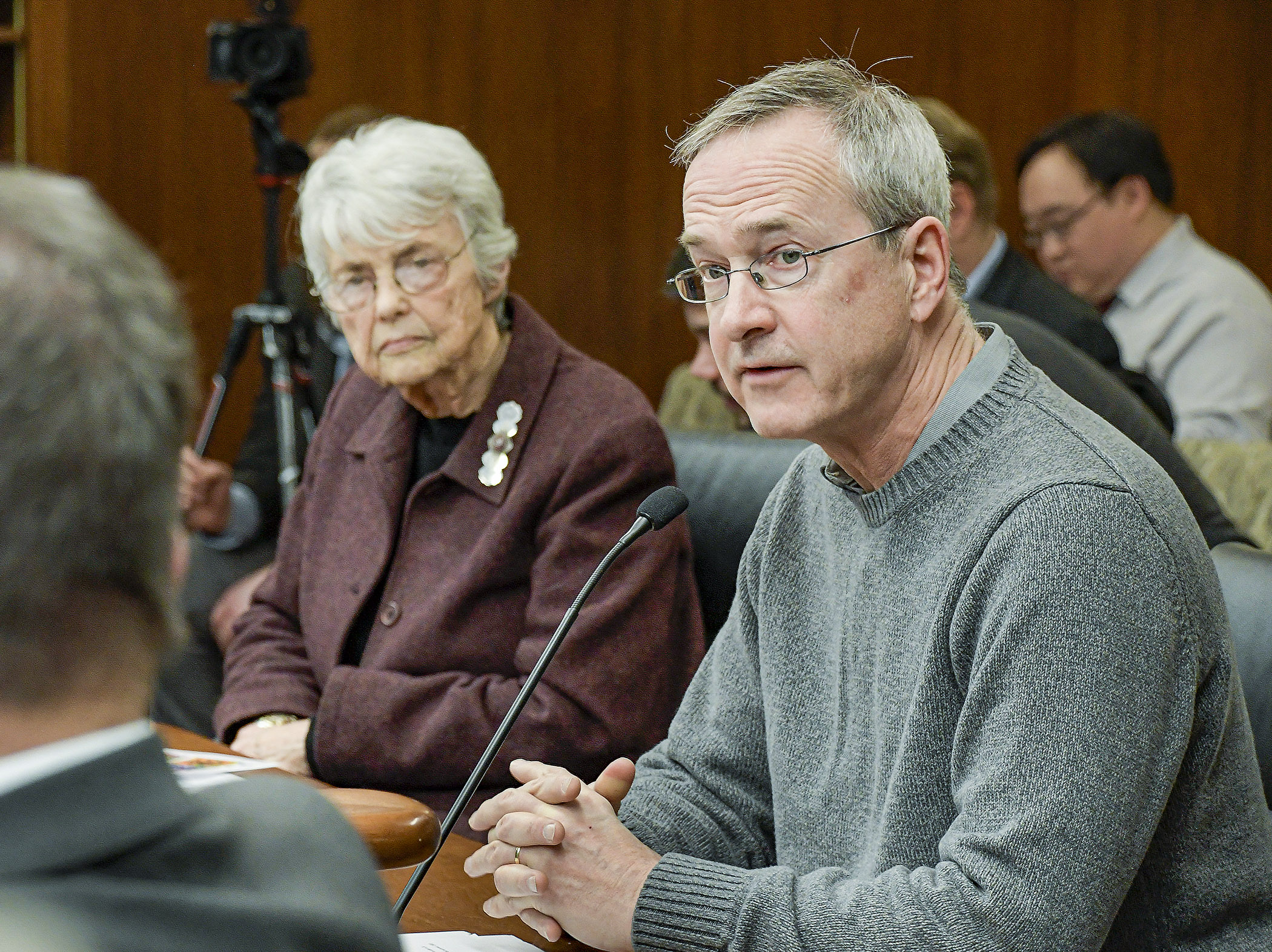 Representing Pesticide Action Network, Chris Cowen testifies before a House committee Feb. 11 in support of Rep. Jean Wagenius' bill, left, that would let cities adopt pesticide control ordinances. Photo by Andrew VonBank 